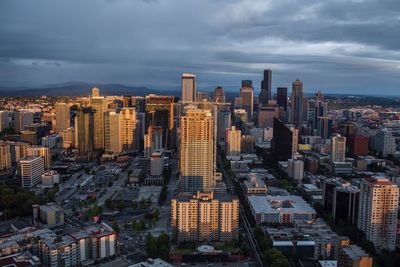 Aerial view of modern buildings in city against sky