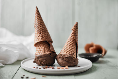 Close-up of ice cream cone on table