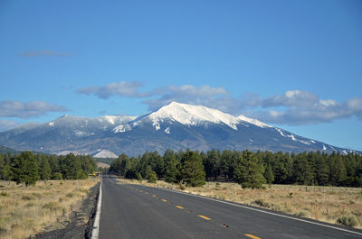 Country road leading towards mountains