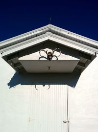 Low angle view of bell tower against clear sky