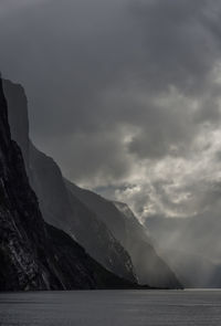 Scenic view of lysefjord and mountains against sky