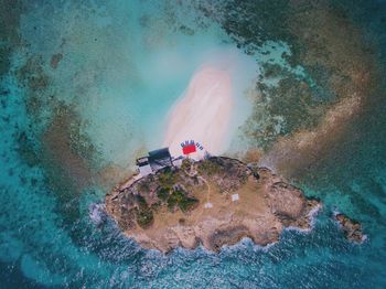 High angle view of people swimming in sea