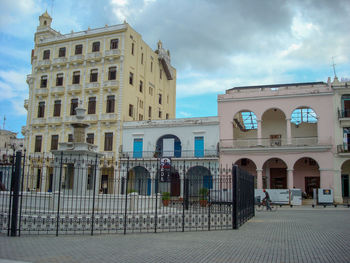 Low angle view of building against cloudy sky