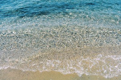 High angle view of surf on beach