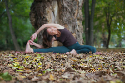 Young woman exercising at park