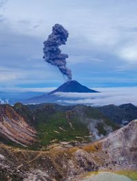 Scenic view of volcanic mountain against sky