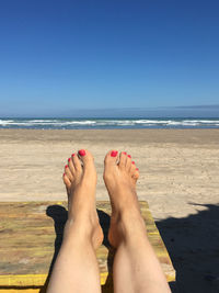 Low section of legs on beach