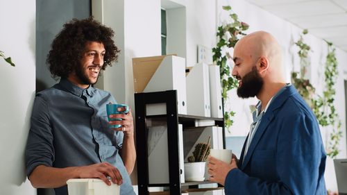 Side view of business colleagues working in office