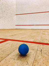 High angle view of ball on hardwood floor