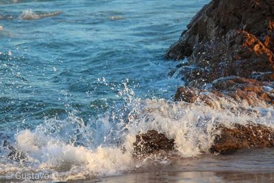 Sea waves splashing on rocks