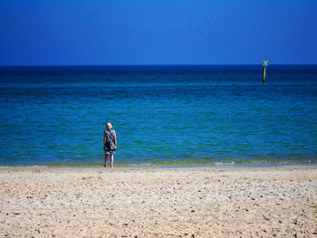 Lone figure on the shore chelsea beach victoria australia