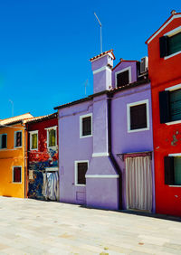 Residential buildings against blue sky