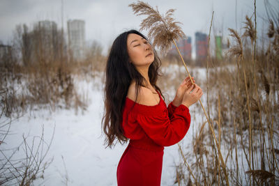 Asian girl in red dress outdoor in winter