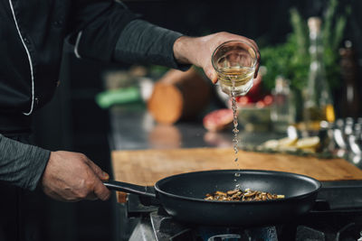 Close-up of chef preparing food in kitchen