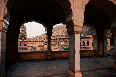 Entrance of old building surrounded by mountains