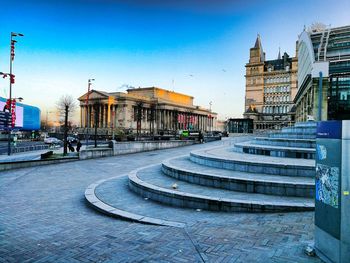 View of cityscape against blue sky