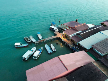 Aerial view of boats moored at harbor