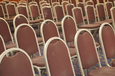 Close-up of empty chairs in stadium