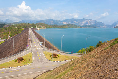 High angle view of road by mountain against sky