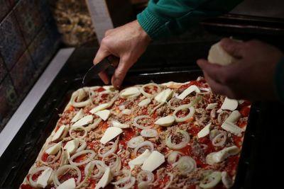 High angle view of person preparing food on table