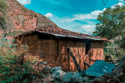 Abandoned building against sky