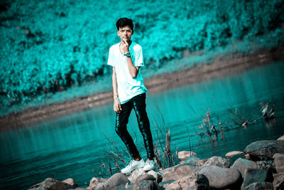 Full length portrait of a man in water