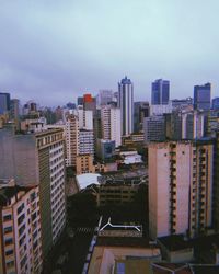 High angle view of buildings in city against sky