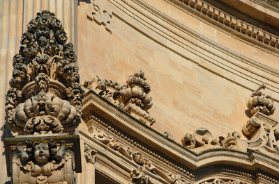 Low angle view of statue against building