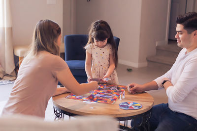 People sitting on table at home