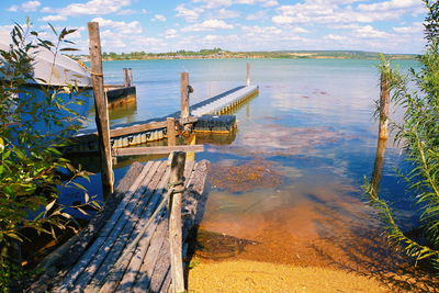 High angle view of pier over lake against sky