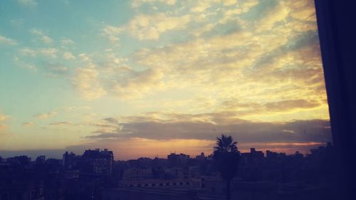 Cityscape against sky during sunset