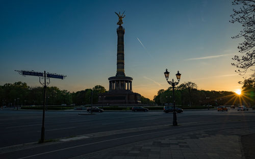 View of street and buildings at sunset