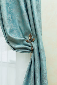 Turquoise curtain fabric in the interior