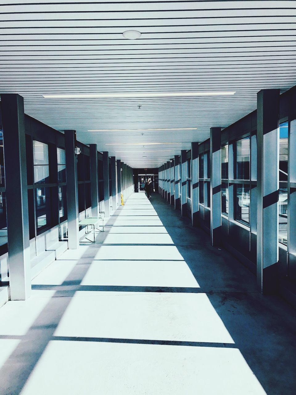 architecture, built structure, direction, the way forward, diminishing perspective, arcade, corridor, indoors, ceiling, no people, building, empty, architectural column, day, in a row, flooring, sunlight, absence, footpath, tiled floor, long, colonnade