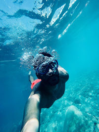 Man swimming in sea