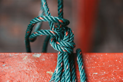 Close-up of rope tied on metal