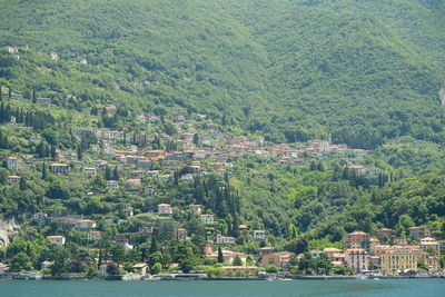 High angle view of townscape by mountain