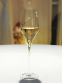Close-up of wineglass on glass table