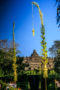 Low angle view of temple against blue sky