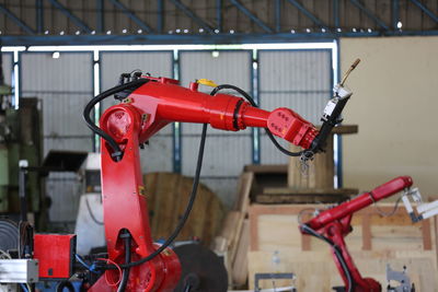 Automatics robot arm and operating control machine in factory.