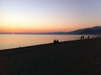 Scenic view of sea against clear sky during sunset