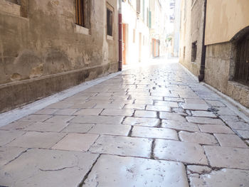 Walkway amidst buildings