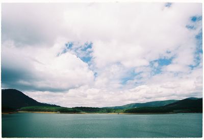 Scenic view of sea against cloudy sky