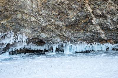 View of icicles on rock formation