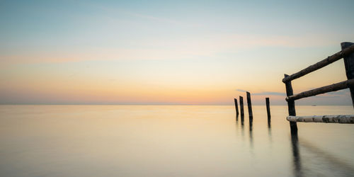 Scenic view of sea against sky at sunset