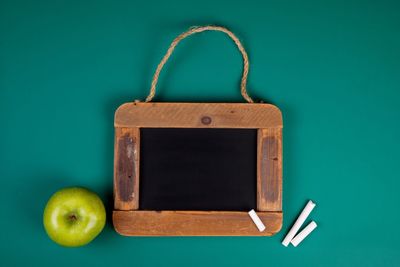 Close-up of apple against blue background