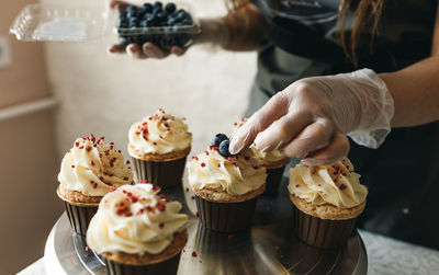 Midsection of man holding ice cream