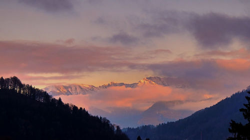 Scenic view of mountains against sky at sunset