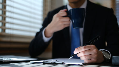 Businesswoman working at table