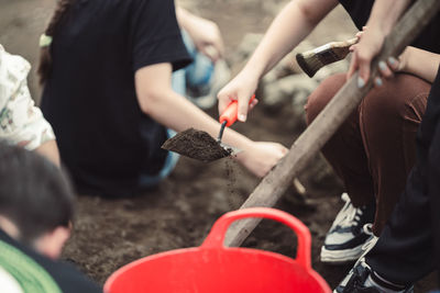 Low section of man working at workshop